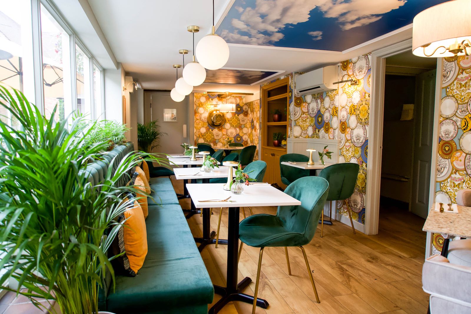 The bright green and gold dining room at Italiano Vero in Stony Stratford